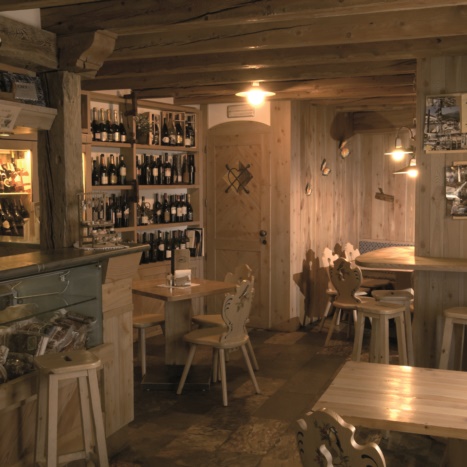 Arredo Bar con Legno Vecchio di abete e larice. Piani in pietra Saustri. Rivestimenti in larice 